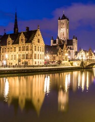 Fototapeta premium Historic buildings by a serene river.