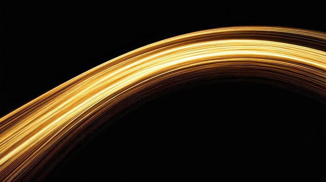 Golden light trails gracefully sweeping across a dark backdrop.