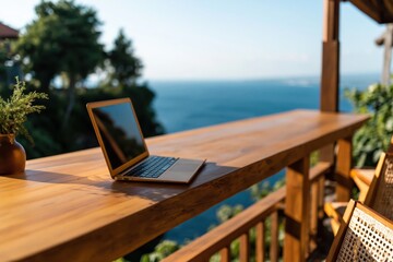 Fototapeta premium Laptop computer on rustic wooden balcony with stunning ocean view work remote