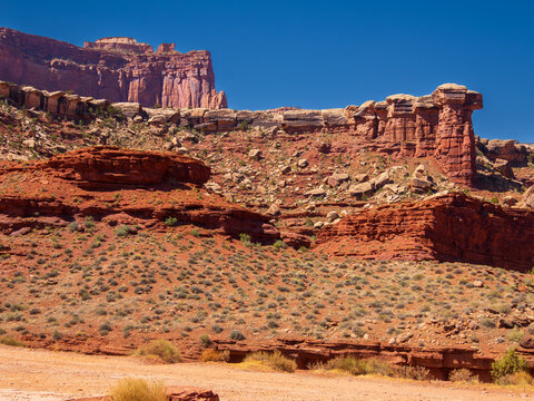 Moab, Utah - May 15, 2026 The white capstone on red sandstone hoodoo columns provide geologic examples of prehistoric sea levels