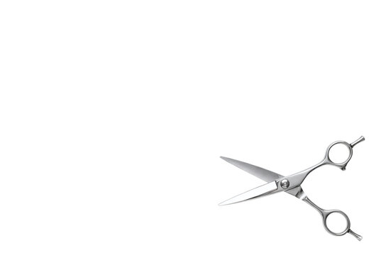 Open professional hairdressing scissors angled on lower right
