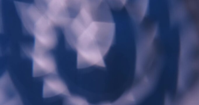 Blur glimmer. Light background. Defocused blue white color lens flare flicker leaking on illuminated creative optical abstraction.