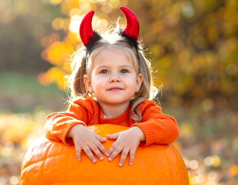 Devilish girl with Pumpkin.
