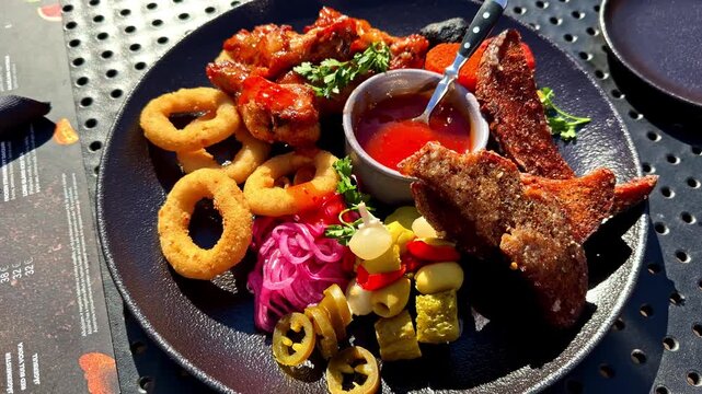 A Colorful Plate of Fried Appetizers, Pickled Vegetables, and Dipping Sauce is Beautifully Arranged, Ready to be Enjoyed - Close Up