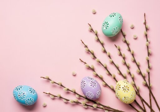Colorful easter eggs with floral patterns and willow branches on pink base
