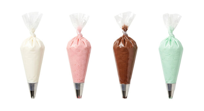 Piping bags filled with colorful frosting creams, isolated on transparent background