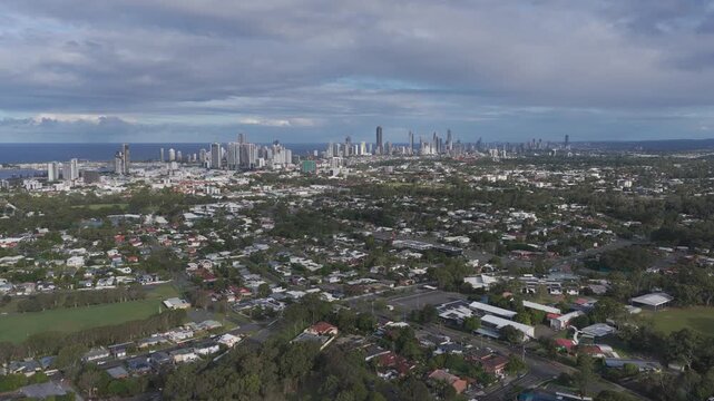 Distant View Of Gold Coast Skyline Across Coastal Suburb Of Labrador In Queensland, Australia. wide aerial shot