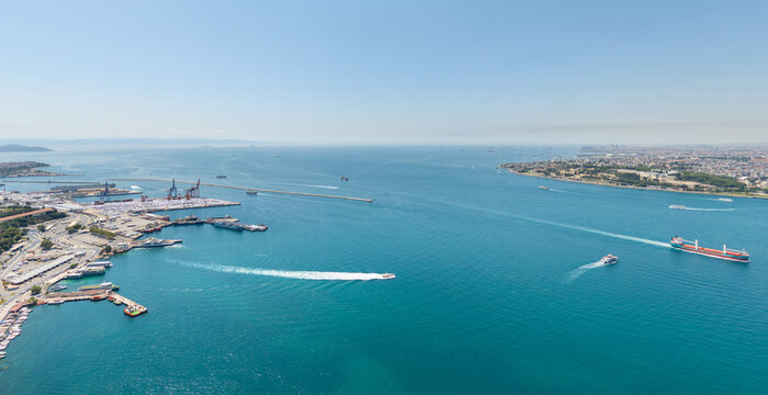 Istanbul, Turkey. Port of Haydarpasa at entrance to Bosphorus from Marmara Sea with dry bulk carrier and Fatih district. Aerial view of maritime hub at summer midday. Aerial view