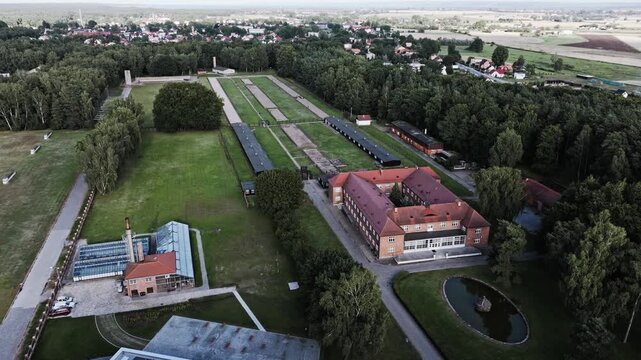 Muted aerial view reveals isolated barracks and wartime prison complex layout