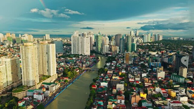 Epic skyline aerial reveals Pasig River glowing through Metro Manila at dusk