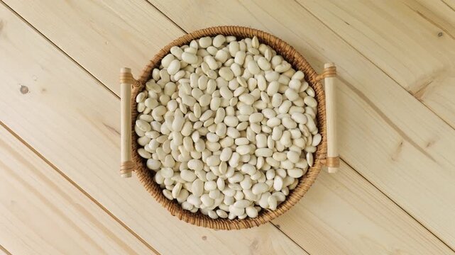 White cannellini beans spinning in a wicker basket