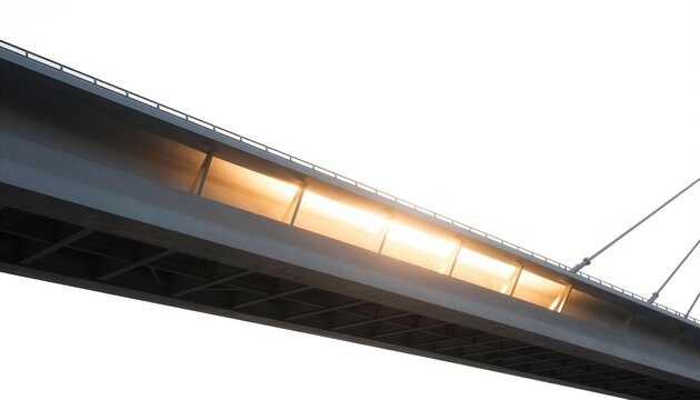 Sunlit modern bridge span photographed from below, showing cables, beams and glowing golden light against a bright sky