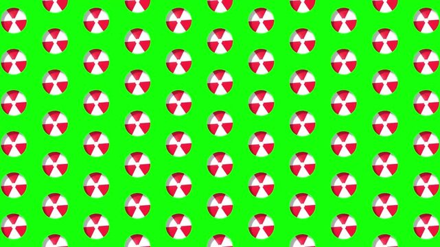 Red and white beach ball pattern scrolling on green screen. 4K Video