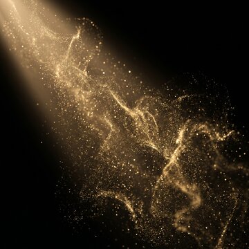 Fine golden cosmic dust particles floating in side light beam on black.