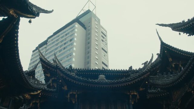 Chongqing Luohan Temple Ornate Dark Roof Carvings Framing Modern Office Tower in Haze
