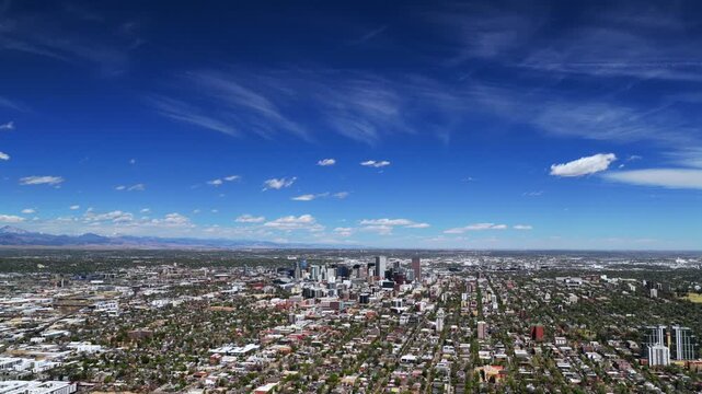 Vast big blue sky Downtown Denver landscape spring summer sunny morning Burnham Yard railyard Denver Broncos stadium aerial drone Colorado i25 cars traffic city buildings Front Range rockies forward