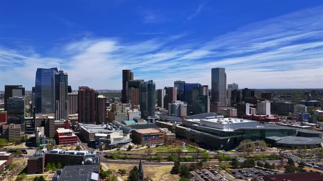 Downtown Lodo Denver Performing Arts Complex Auraria Campus sunny springtime summer morning blue sky Colorado Convention Center aerial drone skyscraper buildings car traffic streets upwards motion