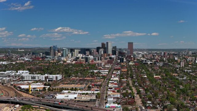 Downtown City of Denver S Broadway cityscape landscape spring summer sunny morning skyscraper buildings aerial drone Colorado i25 cars traffic i25 highway Capitol Hill Front Range circle right up