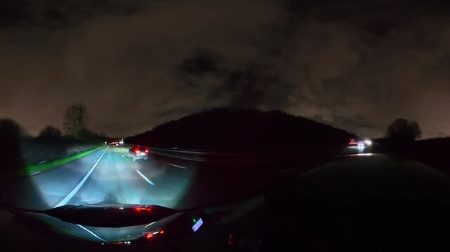 Night Drive on Highways. Car Mounted Camera Footage of Illuminated British Road Travel and Traffic During Night Drive on Motorways and Highways of England United Kingdom
