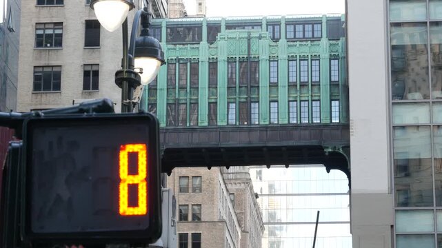 New York City Gimbels bridge, Manhattan Midtown, United States of America. Skybridge on Broadway, Herald Square, USA. Gimbels traverse on 6 avenue. Historic elevated walkway 1925, copper green patina