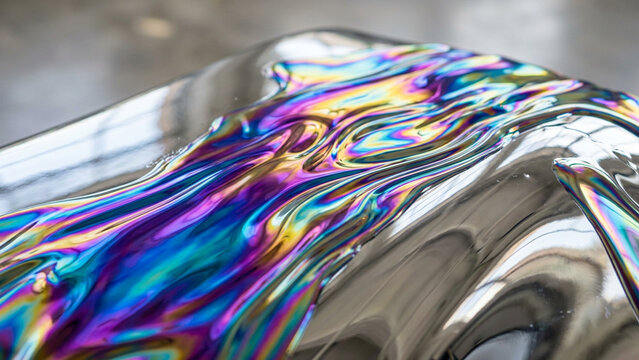 Holographic rainbow liquid iridescent chrome abstract background
