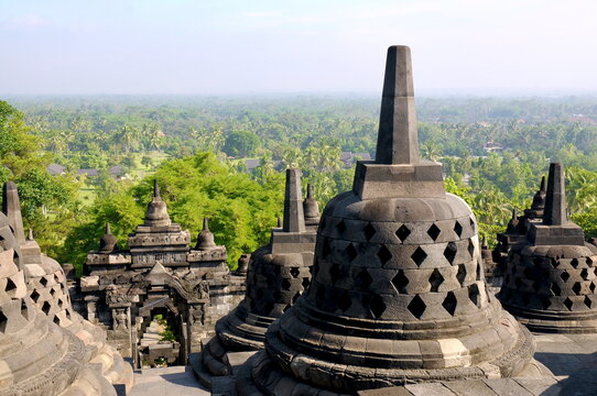 Borobudur Temple &ndash; Stone stupas and temple architecture at the historic Buddhist monument in Central Java, Indonesia, overlooking the surrounding tropical landscape.