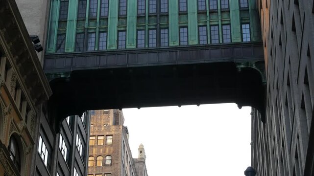 New York City Gimbels bridge, Manhattan Midtown, United States of America. Skybridge on Broadway, Herald Square, USA. Gimbels traverse on 6 avenue. Historic elevated walkway 1925, copper green patina