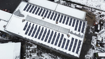 Fototapeta premium Eco-friendly factory rooftops with photovoltaic panels