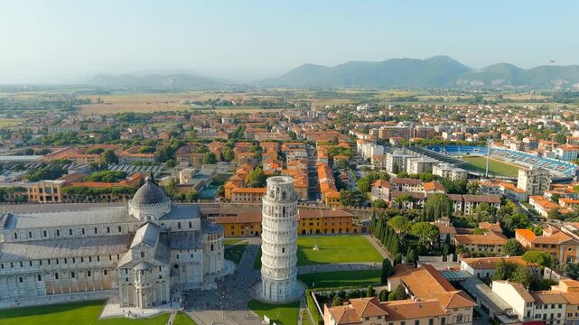 Pisa, Italy. The famous Leaning Tower and Pisa Cathedral in Piazza dei Miracoli. Summer. Evening hours. Drone footage