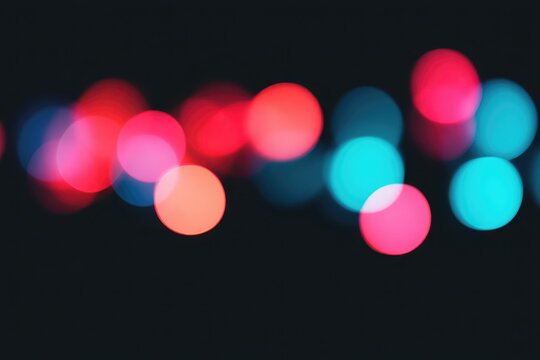 Colorful bokeh lights in vibrant red, blue, and pink tones creating a festive atmosphere.