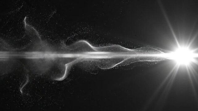 A bright light shines with white smoke on a black background.