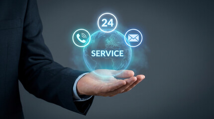 Obraz premium Holographic 24-Hour Service Globe with Phone and Email Icons Floats Above Executive Hand to Offer Round-the-Clock Support, Connect Global Customers, Focusing on Customer Support, Global Connectivity