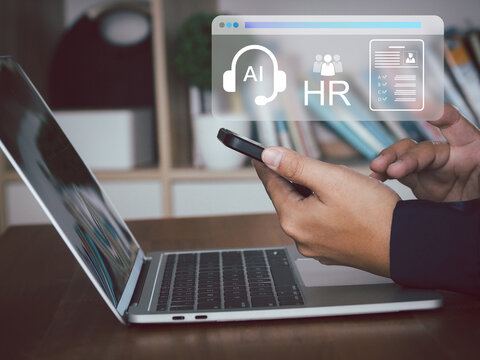AI headset icon human resources interface over professional using smartphone and laptop in office, focused and productive