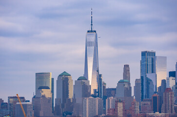 Fototapeta premium Manhattan skyscrapers with blue tones in New York NYC. Manhattan cityscape photography in New York NYC. Manhattan panorama with urban towers in New York NYC.