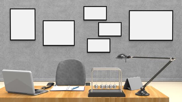 Scrivania con laptop, taccuino e pendolo di Newton in movimento davanti a parete con cornici vuote. Immagine ideale per produttivit&agrave;, business, smart working e concetti aziendali.