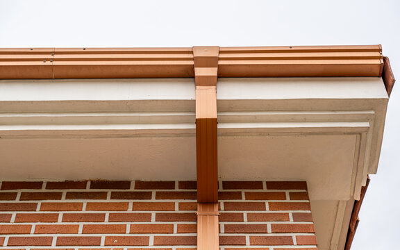 Roof Gutter and Downspout on Brick House