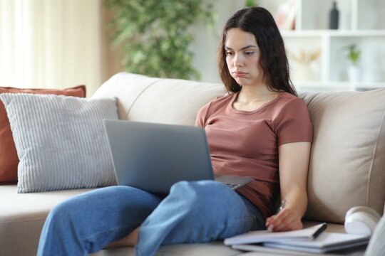 Overwhelmed young student e-learning at home