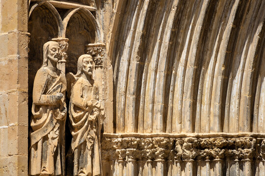 Gothic statues and carved archivolts on the portal of Santa Maria church in Valderrobres
