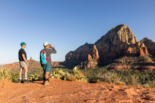 Two male hikers take a break in Sedona Arizona