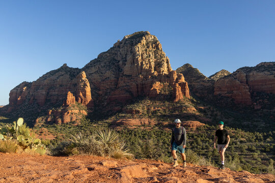 Two men hiking a desert trail in Sedona Arizona