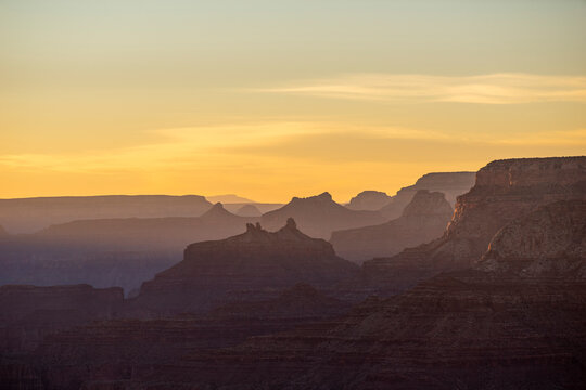 Layers of the Grand Canyon in distant view at sunset