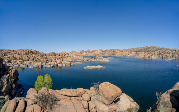 Deep blue lake surrounded by granite rock formations