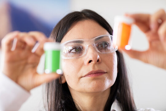 scientist female controlling sample in a laboratory