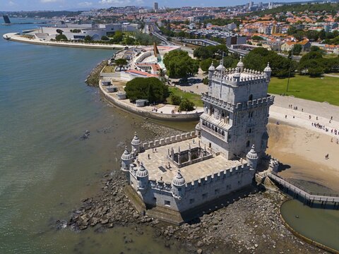 Historic tower on the coast with city in the background and blue water in the foreground, aerial view, Torre de Bel&eacute;m, World Heritage Site, Belem, Bethlehem, Lisbon, Lisboa, River Tagus, Portugal