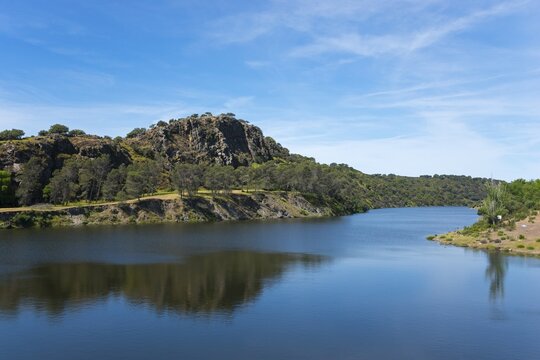 River with large rock in the background and blue sky, landscape characterised by natural wonders, River Ti&eacute;tar, Tietar, Monfrag&uuml;e National Park, C&aacute;ceres, Caceres, Extremadura, Spain