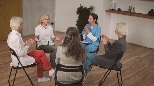 Group therapy for women, aged ladies communication with physician in clinic. Psychology and mutual support group, discussion better aging and anti-age treatments for stay healthy and active after 60