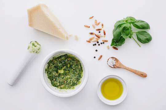 Ingredients for pesto on white ground