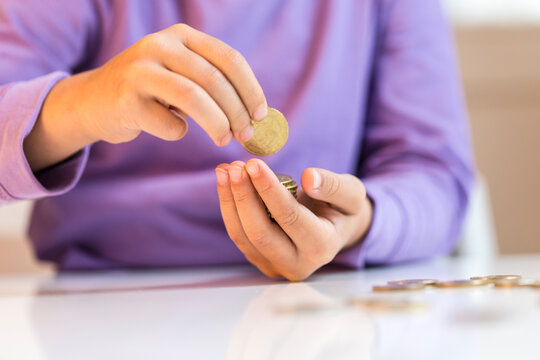 Little girl counting pocket money