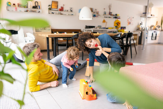 Happy family playing with their kids on a weekend