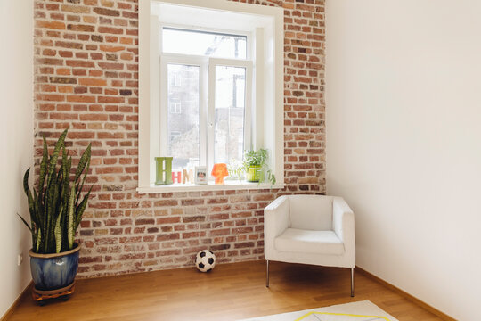 Room with brick wall in modern building